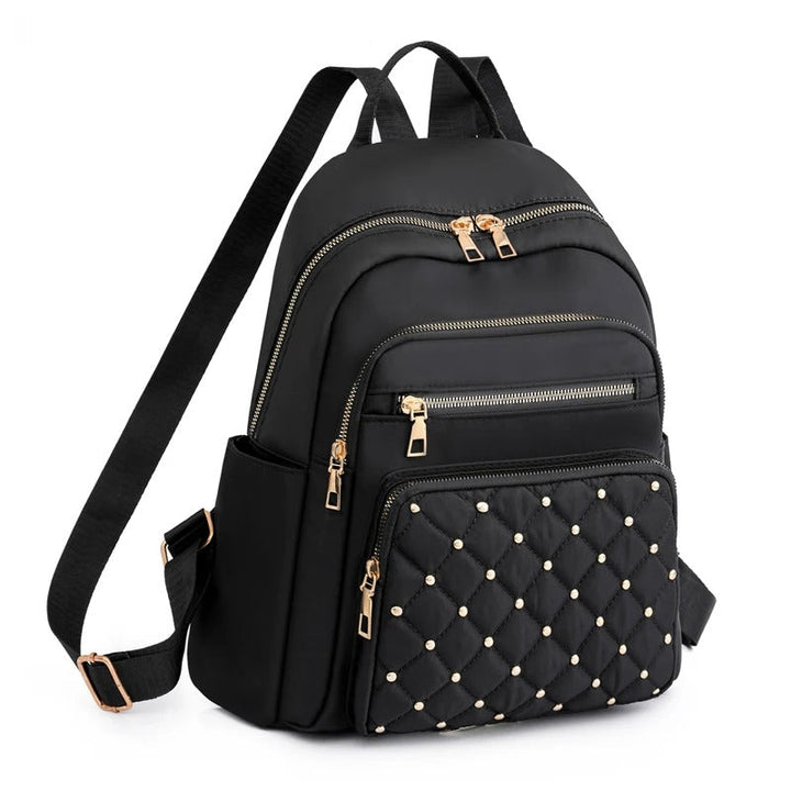 Women's lightweight nylon backpack for daily use. Water-resistant travel & school bag for comfort.