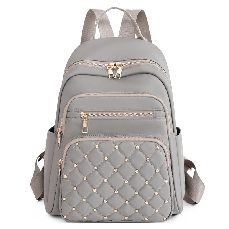 Durable lightweight nylon backpack for women. Perfect water-resistant school, travel & daily commuter bag.