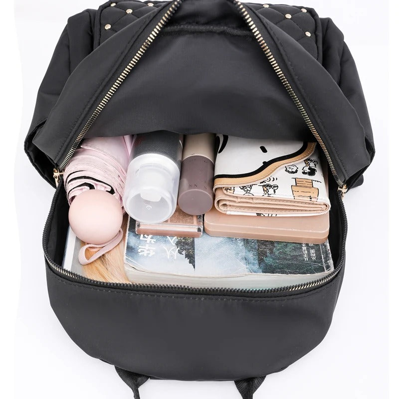 Versatile women's nylon travel backpack, lightweight & water-resistant for college or daily adventures.
