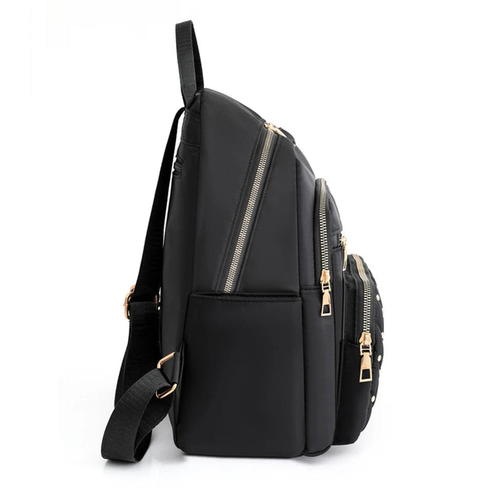 Close-up of women's water-resistant nylon backpack, highlighting spacious compartments & secure zippers.