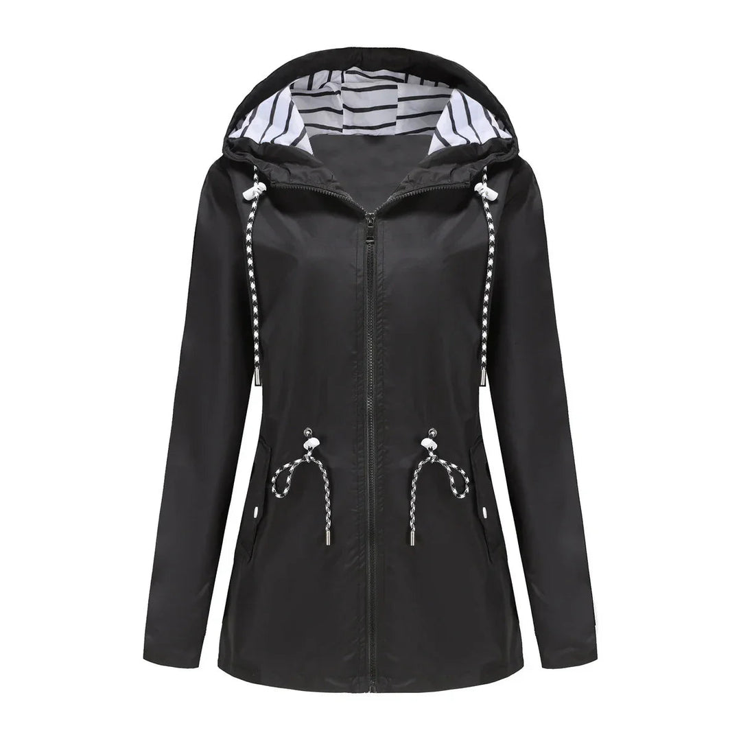Back view: Women's lightweight waterproof trench coat. Stylish hooded outerwear, great for all-season travel.