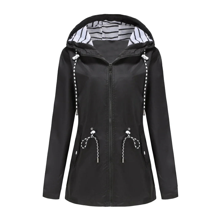 Back view: Women's lightweight waterproof trench coat. Stylish hooded outerwear, great for all-season travel.
