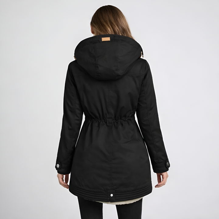Stylish women's hooded utility parka. Mid-length, with an adjustable drawstring waist for a flattering fit & warmth.