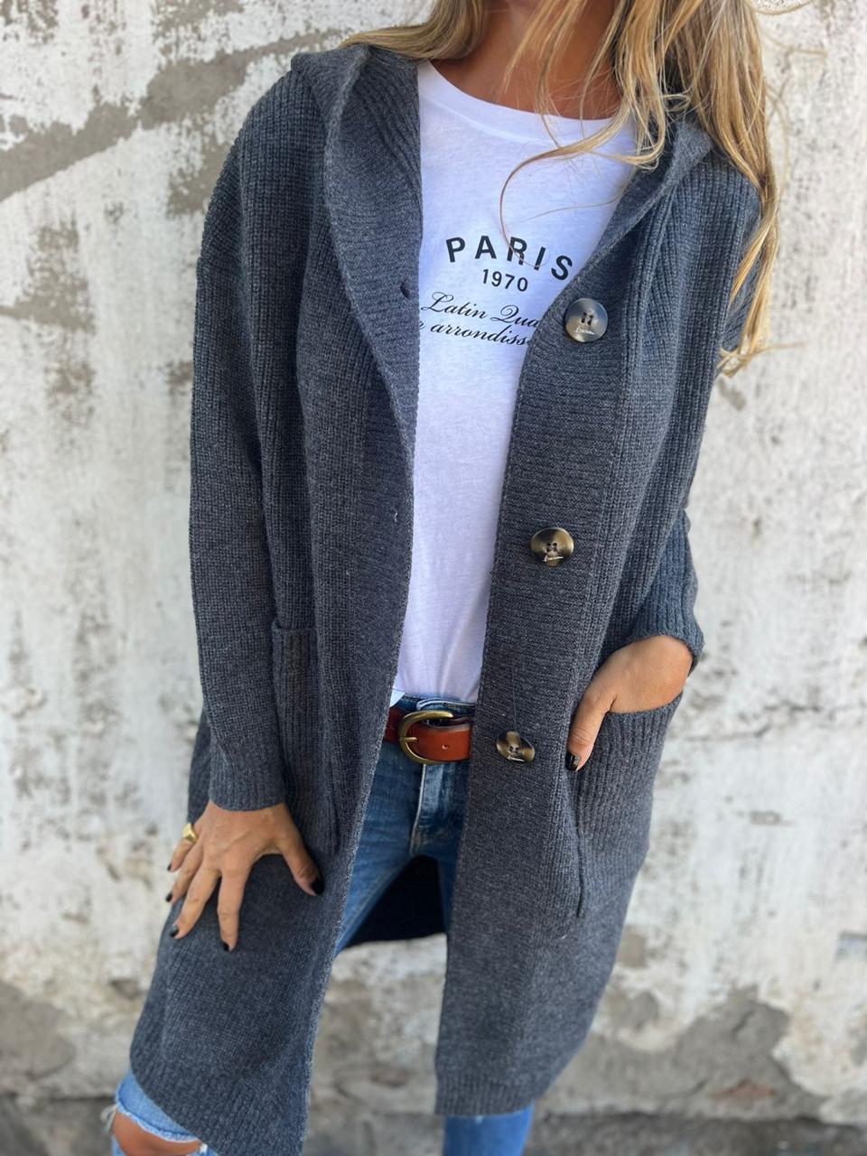 Close-up of a women's cozy long knit cardigan, showcasing soft knit fabric and detailed buttons for casual wear.