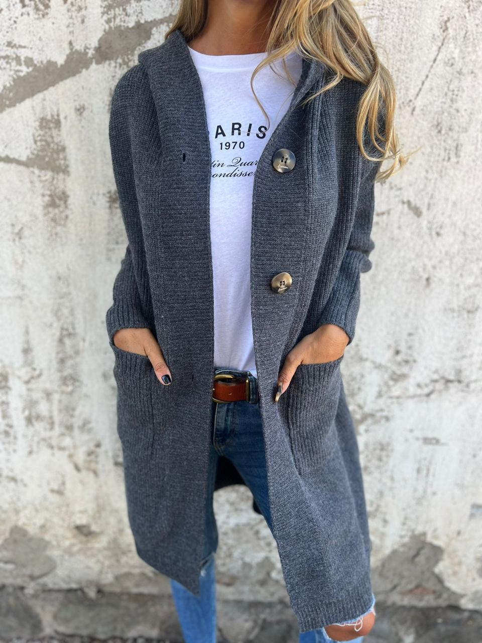 Back view of a women's long knit cardigan with buttons, featuring a flowing design for comfortable autumn layering.