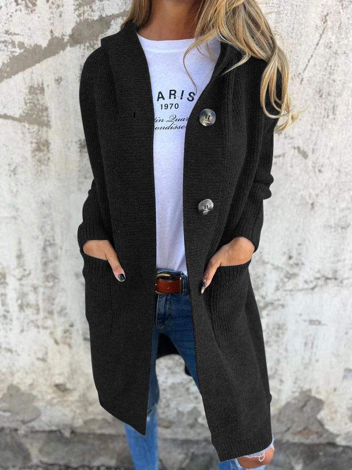 Detailed view of decorative buttons on a women's long knit cardigan, adding style to this cozy layering piece.