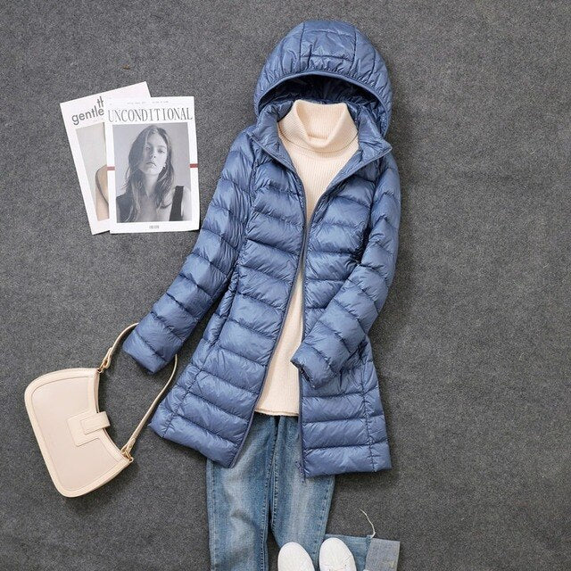 Long women's puffer winter coat. Stay cozy and stylish in cold weather with this warm, hooded jacket.