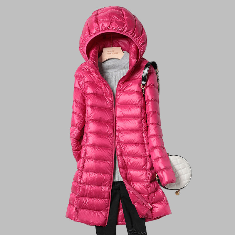 Comfortable & stylish women's long puffer coat, designed with a detachable hood for ultimate winter warmth.