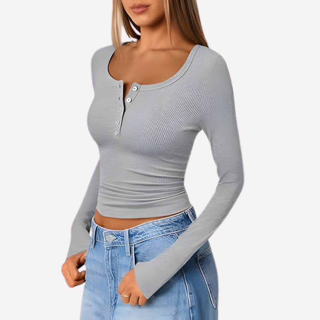 Woman wearing a comfortable long sleeve ribbed Henley top, ideal for everyday casual style & fashion.