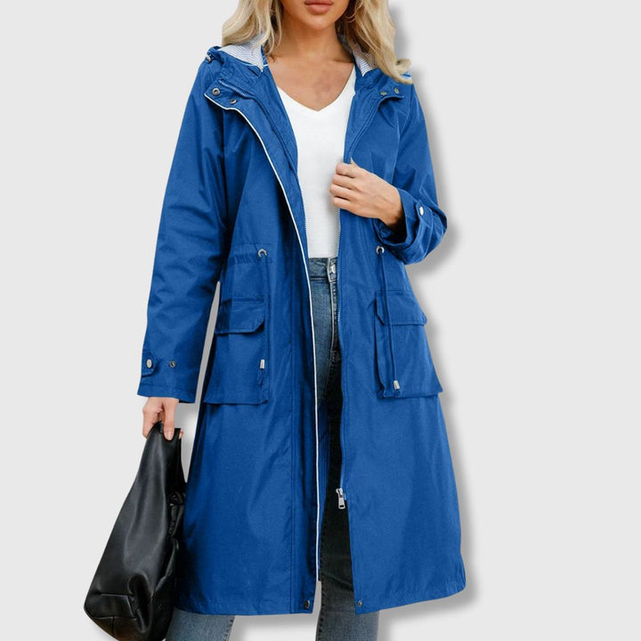 Stylish women's long hooded rain jacket. Lightweight, versatile outerwear providing all-weather protection.