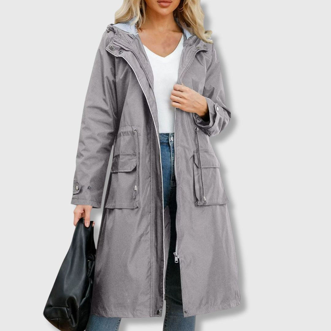 Lightweight women's waterproof long rain jacket. Hooded for extra protection against spring & fall wet weather.