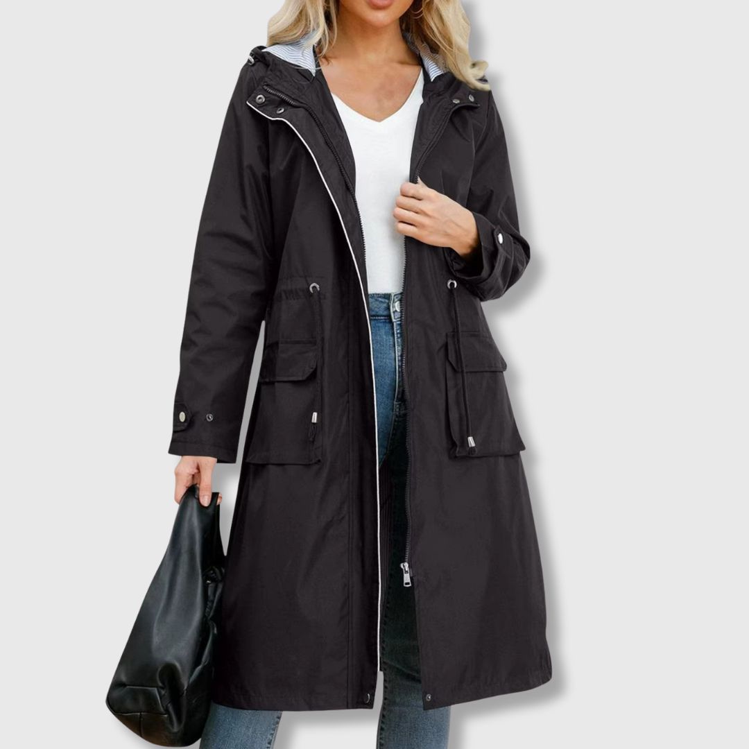 Versatile women's long rain jacket featuring a hood, drawstring waist, and zip-up front. Great lightweight outerwear.