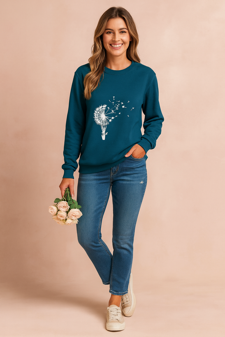 Unique women's loose fit sweatshirt featuring an artistic dandelion graphic print. Comfortable long sleeve top.
