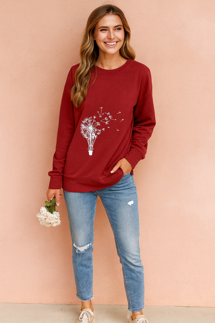 Dandelion print women's loose fit pullover sweatshirt. Soft, comfortable long sleeve graphic sweater for casual wear.