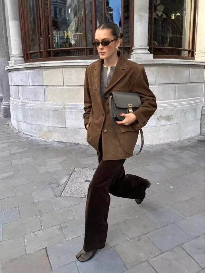 Soft brown suede oversized button-front jacket for women, featuring a notched lapel. A stylish and comfortable layering piece.