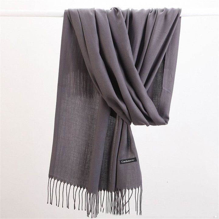 Stylish women's cashmere scarf, ideal for cold weather fashion and comfort.