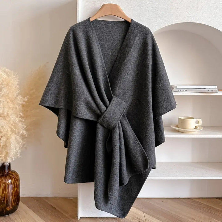 Fashionable women's windproof poncho scarf coat. An elegant, cozy wrap for chic winter outerwear style.