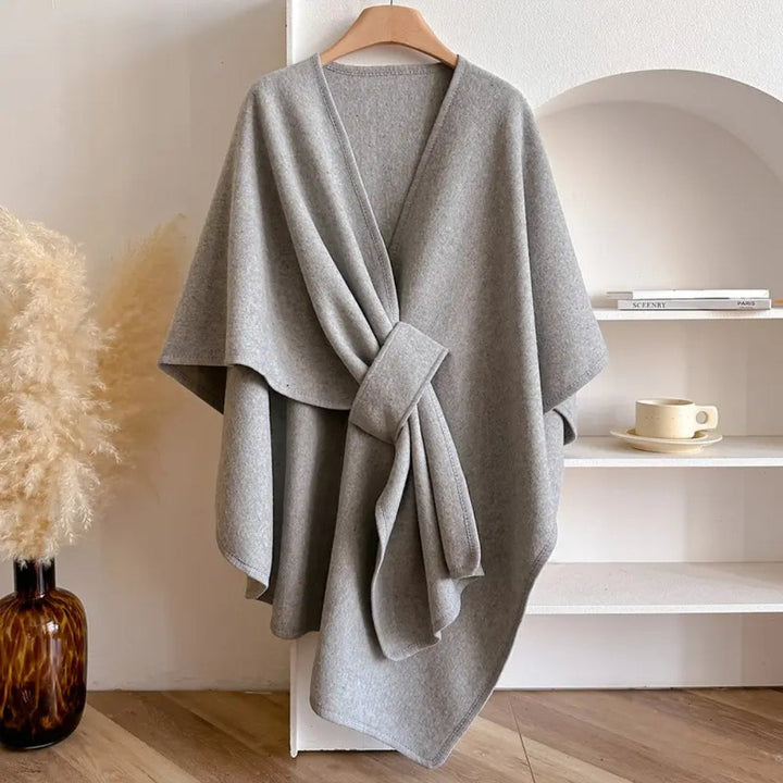 Luxurious women's elegant wrap poncho scarf coat, a chic and cozy windproof accessory for autumn outerwear.