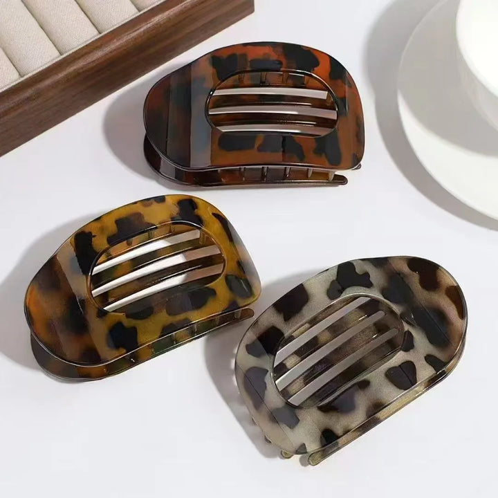 Secure grip matte oval hair clip, ideal for quick women's updos.