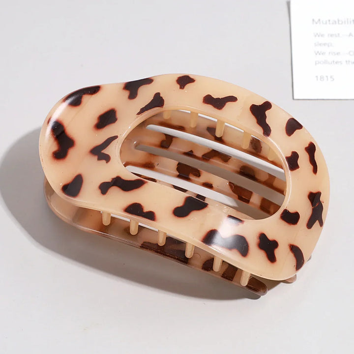 Versatile women's matte oval hair clip for various stylish hairstyles.