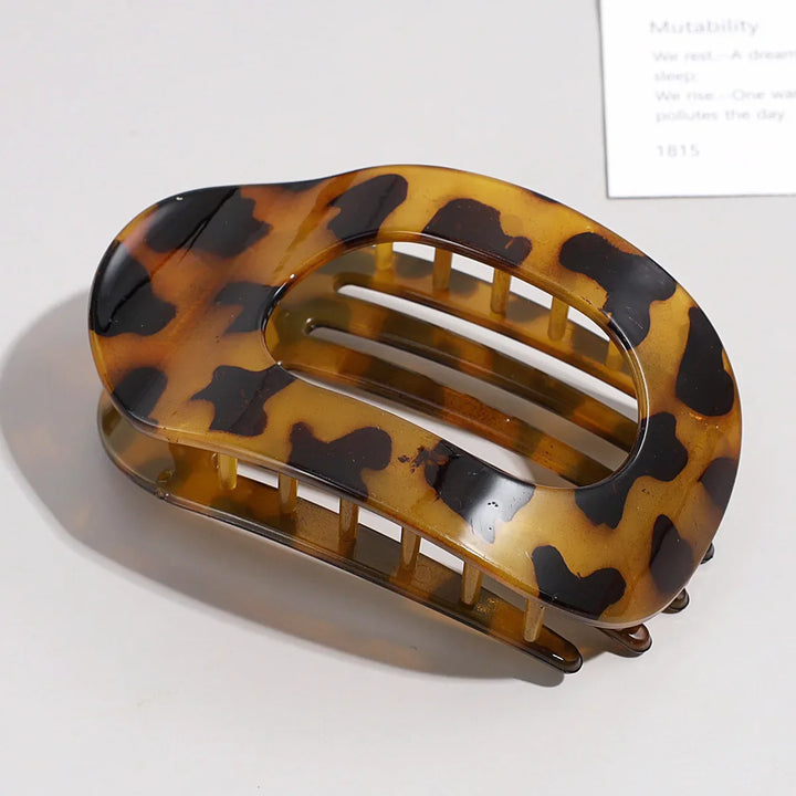 Simple & secure women's matte oval flat hair clip for daily use.