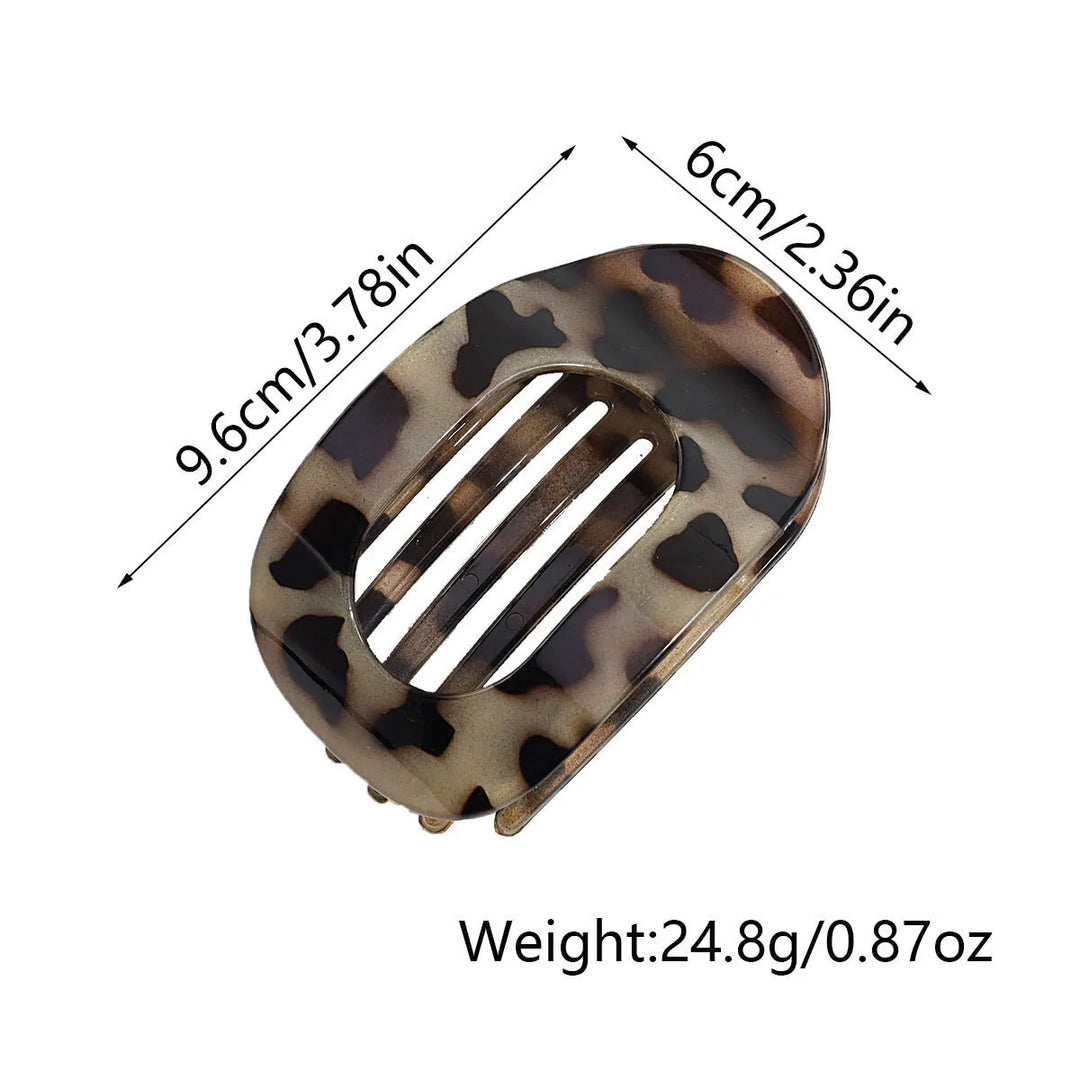 Fashionable matte oval flat hair claw, ideal for sleek women's updos.