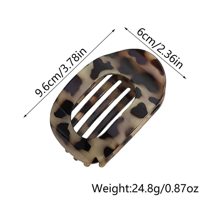 Fashionable matte oval flat hair claw, ideal for sleek women's updos.