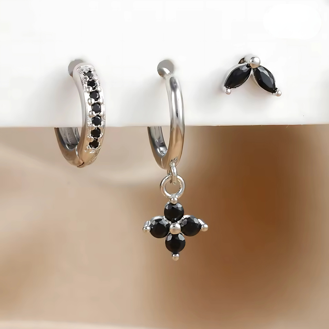 Women's minimalist piercing set: hypoallergenic stainless steel studs & hoops for comfortable all-day wear.