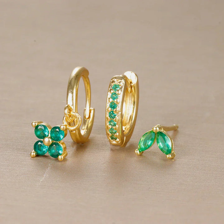 Gold tone minimalist piercing set for women, featuring hypoallergenic studs & small hoops, perfect for daily styling.