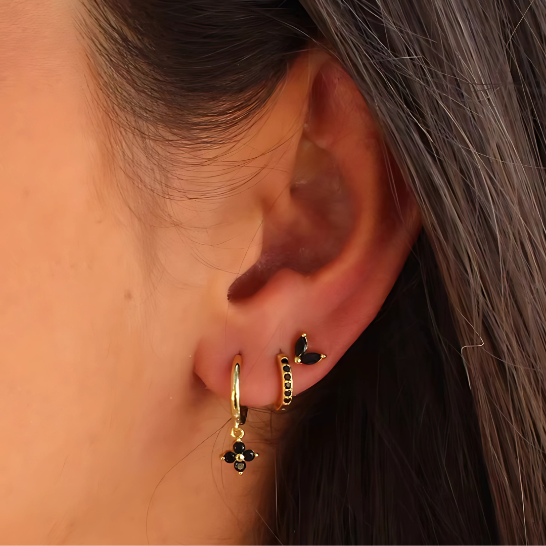 Minimalist piercing set: glittering cubic zirconia studs & classic hoops in hypoallergenic stainless steel for women.