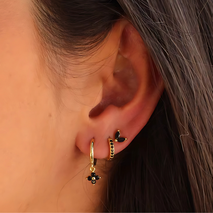 Minimalist piercing set: glittering cubic zirconia studs & classic hoops in hypoallergenic stainless steel for women.
