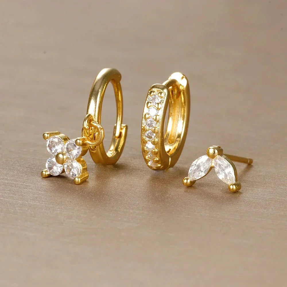 Stylish women's minimalist piercing set featuring versatile studs and delicate hoops in durable stainless steel.