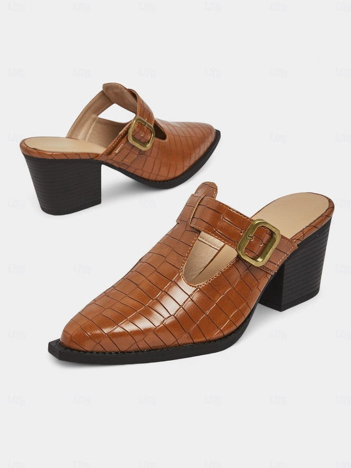 Stylish women's block heel mules with elegant buckle and intricate cut-out design. Ideal day to night footwear.