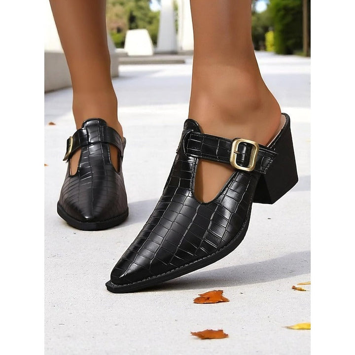 Versatile women's slip-on mules featuring a fashionable block heel, buckle, and cut-out. Perfect for casual or chic outfits.