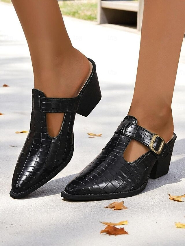 Women's block heel mules with a chic buckle detail and unique cut-outs. Easy slip-on style for all-day comfort.