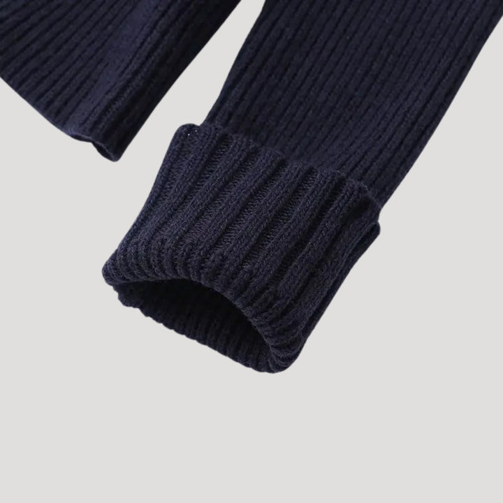 Women's long sleeve navy cardigan styled for versatility, featuring elegant contrast trim detail.