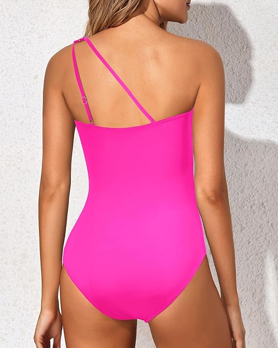 Attractive women's one-shoulder tummy control beachwear, making a stylish statement by the water.