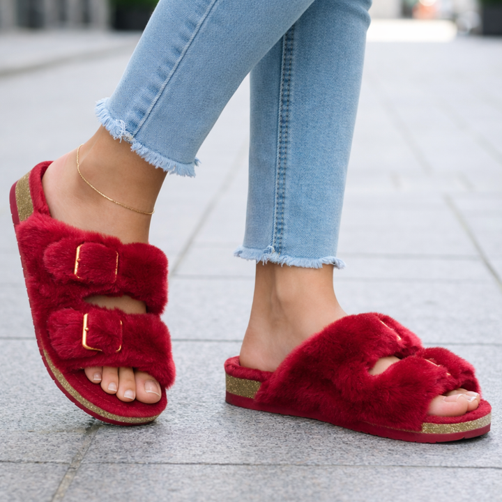 Woman wearing cozy open toe slippers, demonstrating comfort & style for home or casual use.