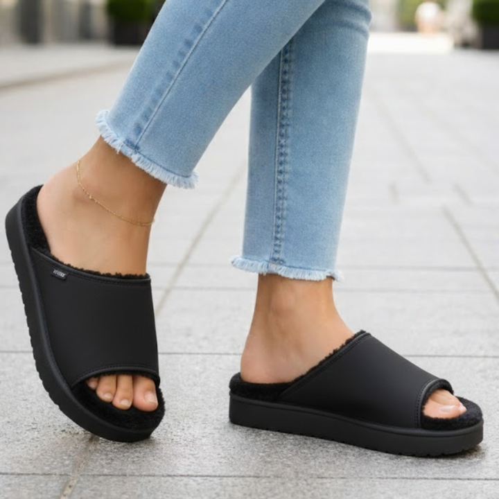 Pair of women's open toe slide-on slippers, perfect for indoor/outdoor comfort & relaxation.
