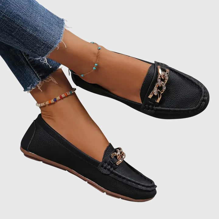Close-up of women's comfortable orthopedic loafers, highlighting arch support technology and premium design.