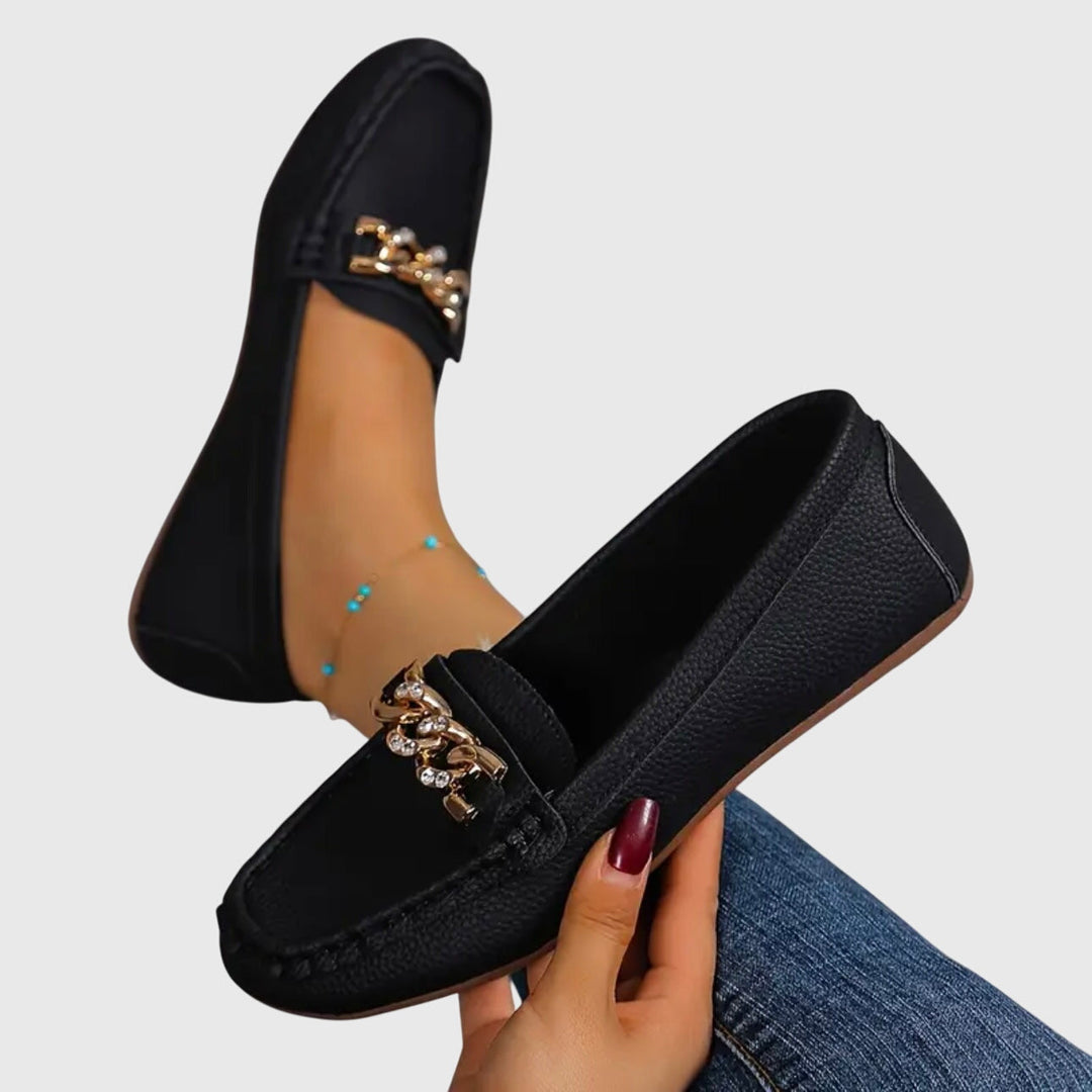 Classic black women's orthopedic loafers, combining timeless style with superior arch support for all-day comfort.