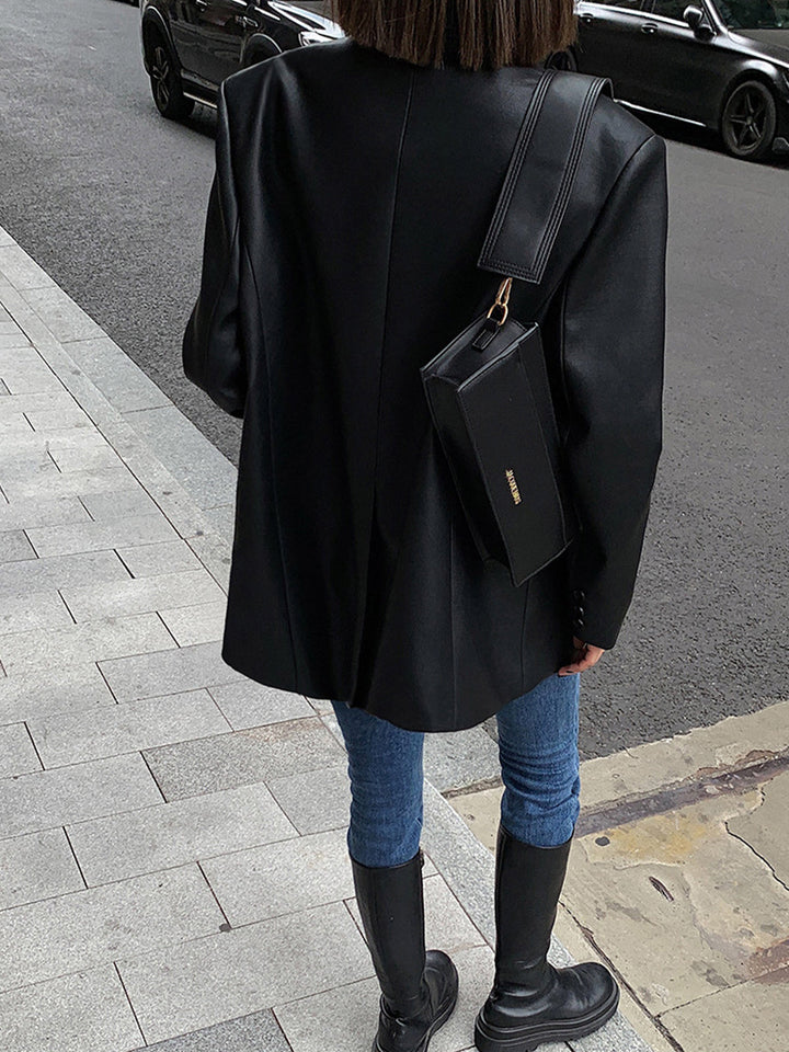 Chic women's oversized blazer with a stylish lapel collar. Perfect versatile outerwear for autumn & winter fashion.
