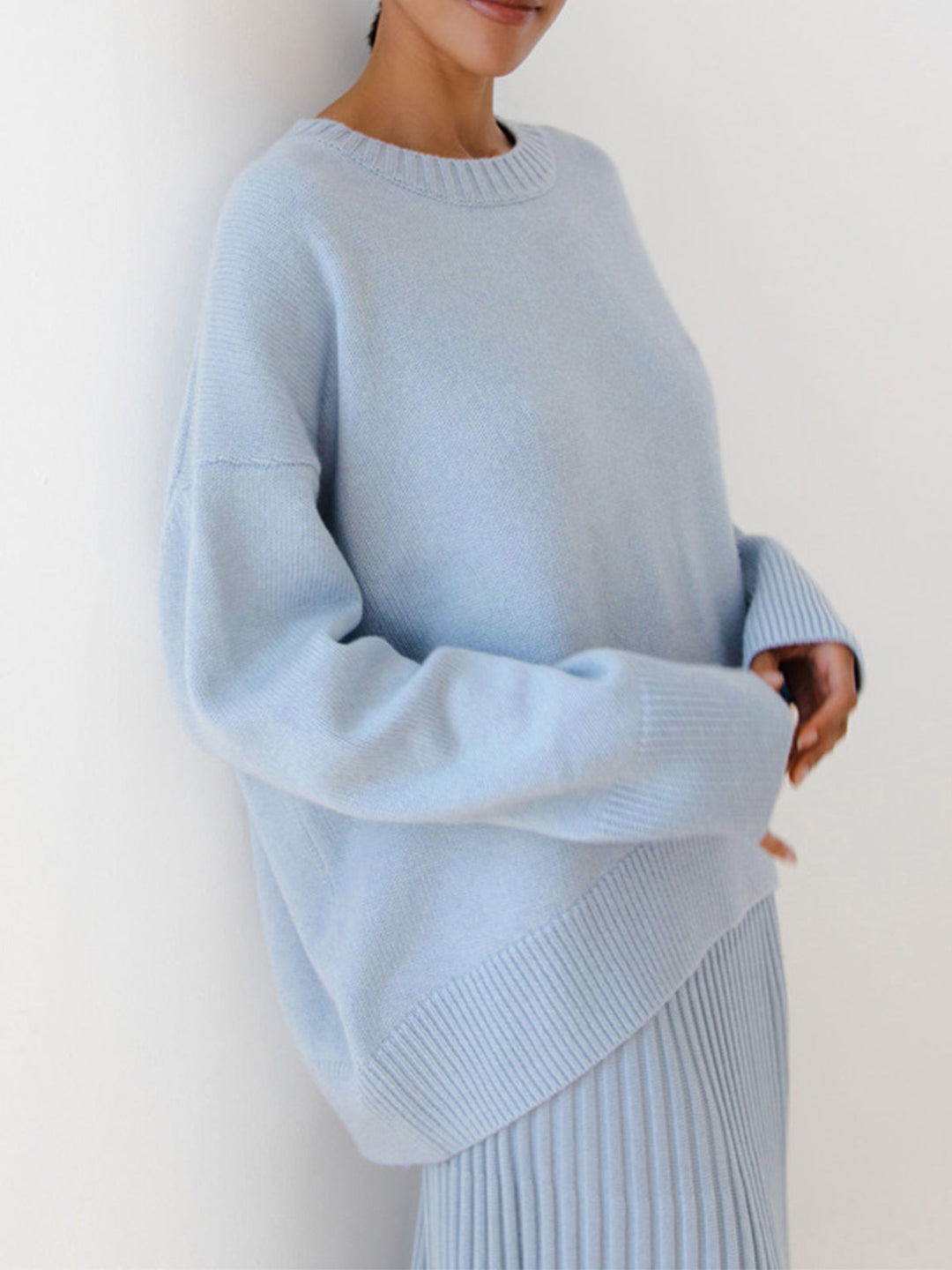 Cream women's oversized crewneck knit sweater. Cozy, relaxed fit for fall/winter layering.