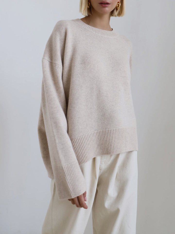 Winter style women's oversized crewneck knit sweater. Warm, relaxed fit, a cozy layering piece.