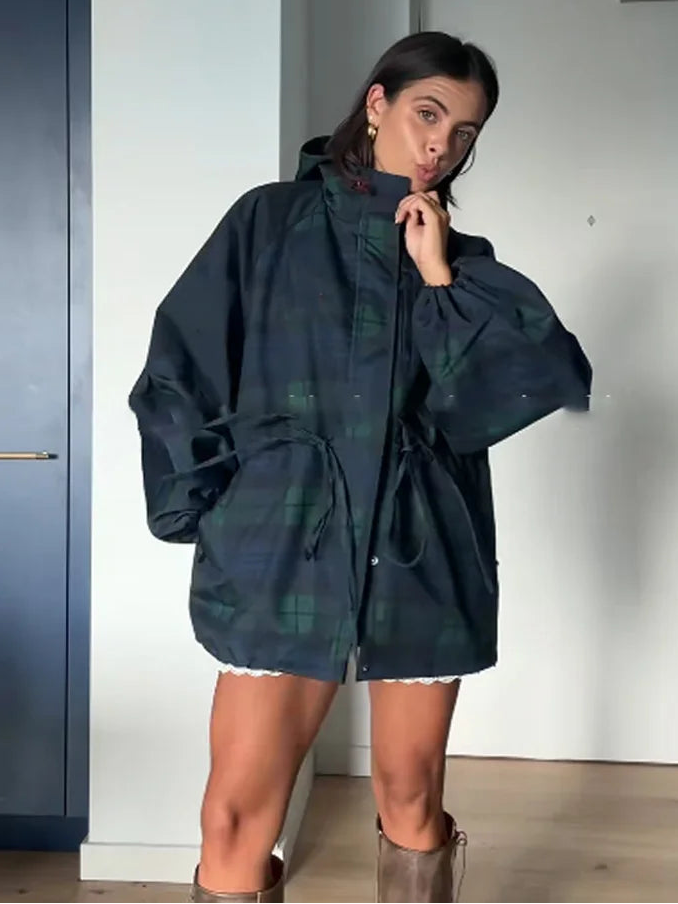 Stylish women's oversized utility plaid jacket with hood and adjustable waist, ideal for spring or fall casual wear.