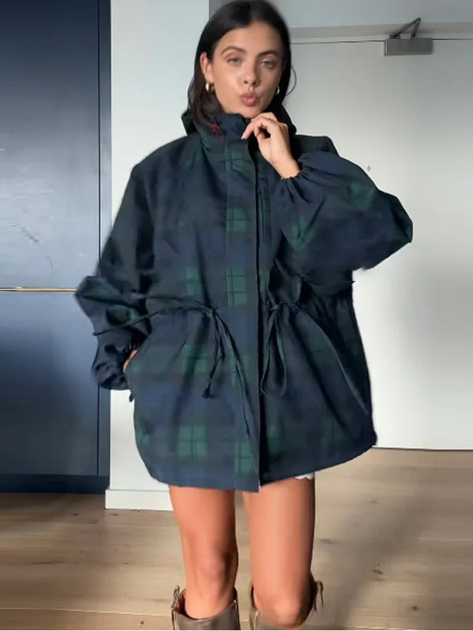 Casual women's dark blue plaid oversized jacket, featuring a cozy hood and adjustable waist for a comfortable fit.