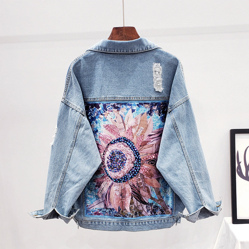 Women's oversized denim jacket with unique graphic back print, perfect for casual streetwear & trendy fall fashion.