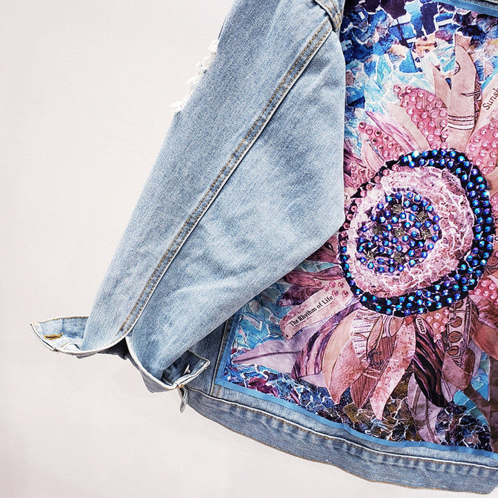 Trendy women's oversized denim jacket with a bold back print, a statement piece for casual fashion & streetwear.