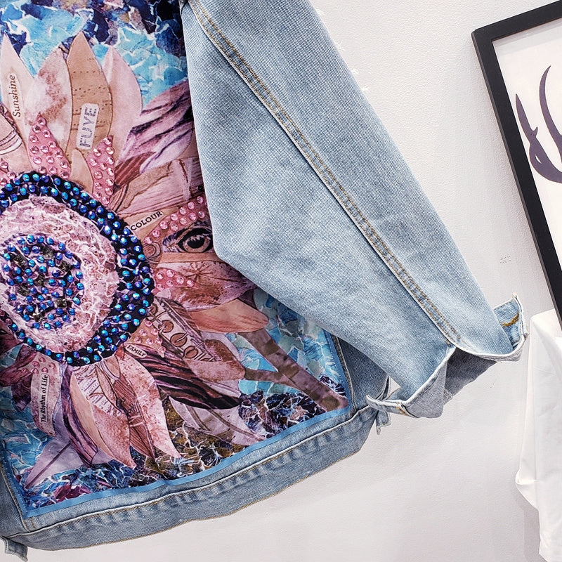 Oversized women's denim jacket 'Lynn' with eye-catching back print, a stylish choice for spring & fall outerwear.