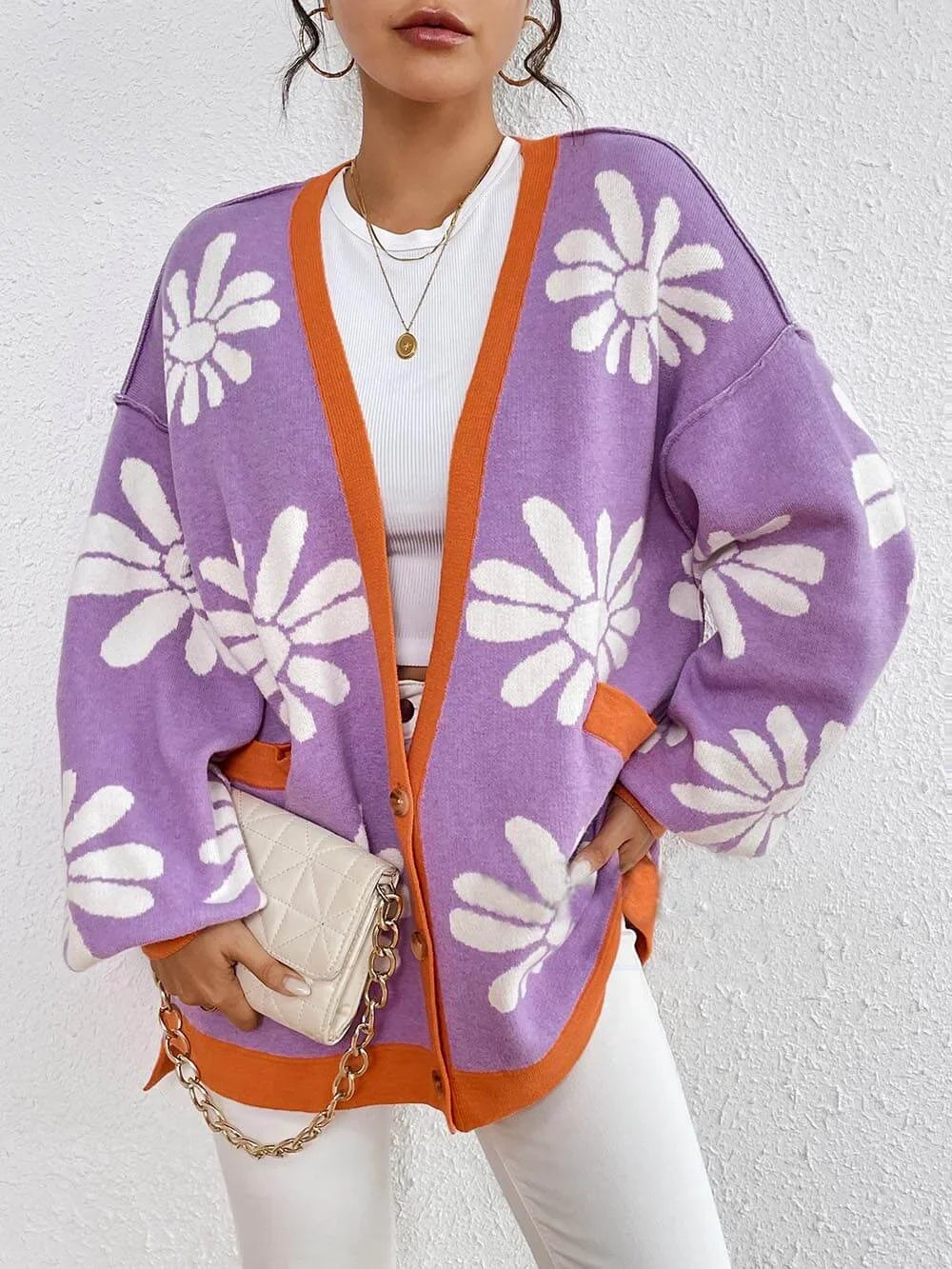 Women's oversized floral print cardigan for a casual chic look. Comfortable long-sleeve layering piece, perfect for everyday fashion.